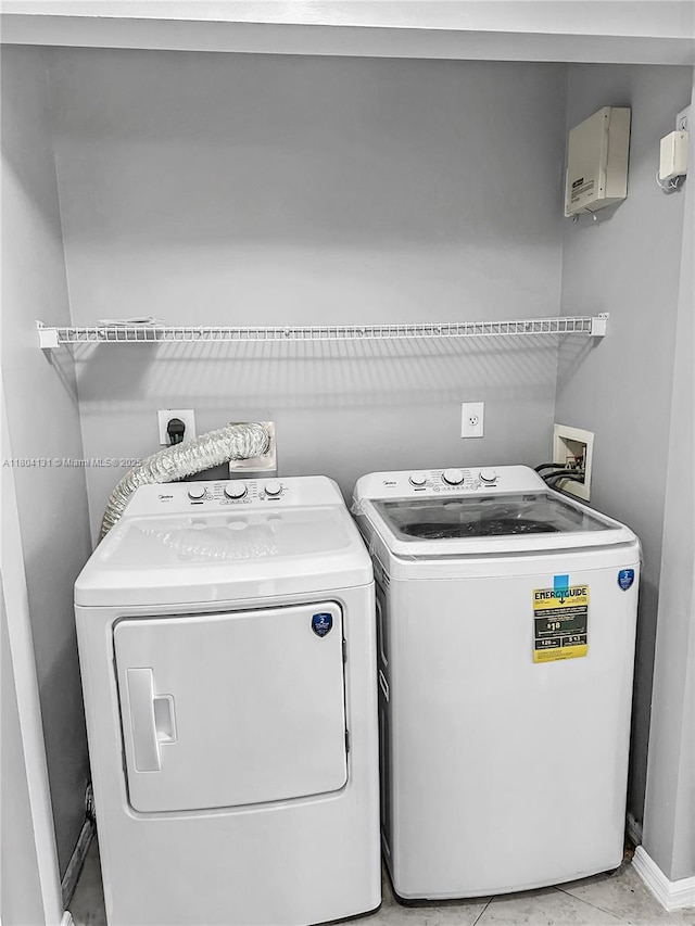 clothes washing area with independent washer and dryer