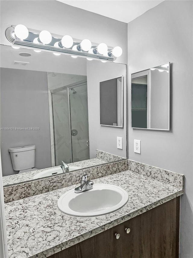 2240 E Preserve Way Unit 205, Miramar, FL 33025 - bathroom featuring a shower stall, vanity, and toilet