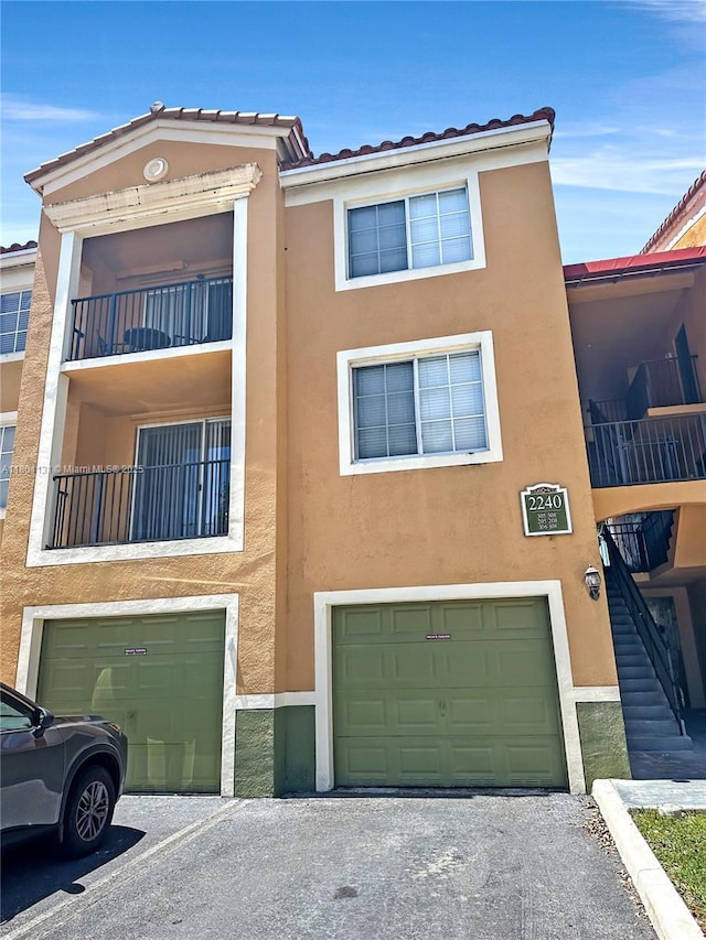 2240 E Preserve Way Unit 205, Miramar, FL 33025 - view of building exterior with a garage
