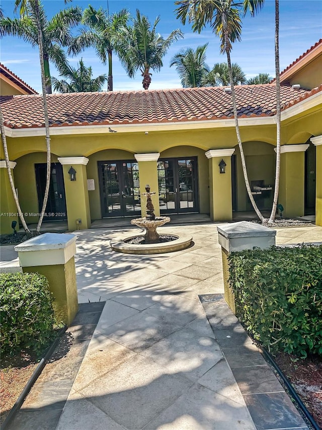 2240 E Preserve Way Unit 205, Miramar, FL 33025 - property entrance featuring french doors, stucco siding, and a tile roof