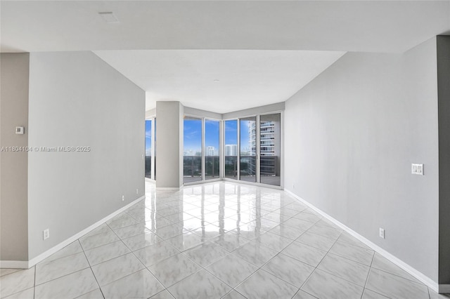 3200 N Ocean Blvd Unit 1206, Fort Lauderdale, FL 33308 - tiled spare room with baseboards