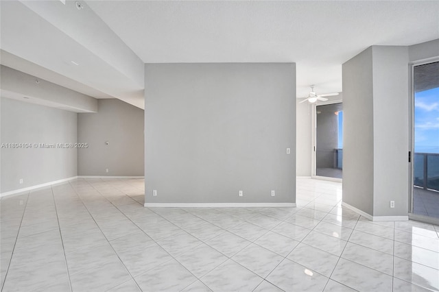 3200 N Ocean Blvd Unit 1206, Fort Lauderdale, FL 33308 - spare room with a ceiling fan, light tile patterned floors, and baseboards