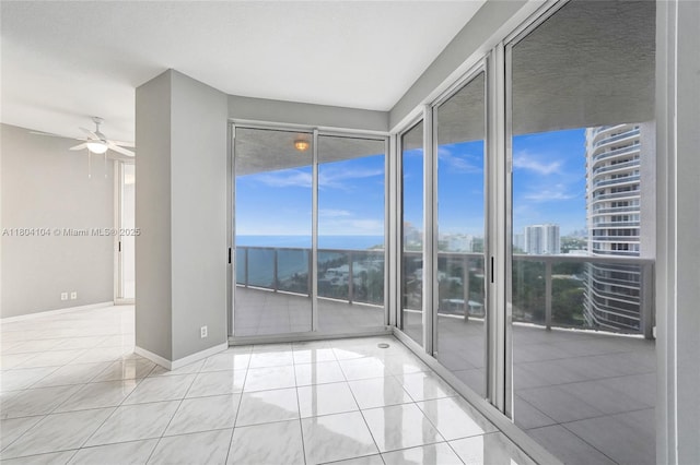 3200 N Ocean Blvd Unit 1206, Fort Lauderdale, FL 33308 - tiled spare room with ceiling fan, healthy amount of natural light, baseboards, and a city view