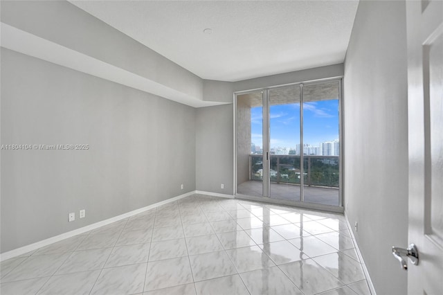 3200 N Ocean Blvd Unit 1206, Fort Lauderdale, FL 33308 - unfurnished room featuring baseboards and a view of city