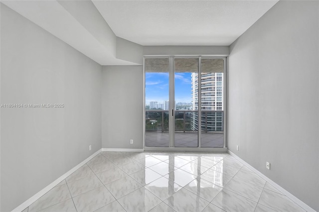 3200 N Ocean Blvd Unit 1206, Fort Lauderdale, FL 33308 - empty room with a city view and baseboards