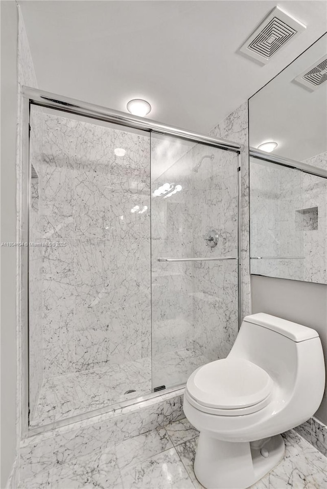3200 N Ocean Blvd Unit 1206, Fort Lauderdale, FL 33308 - bathroom featuring toilet, a stall shower, and marble look tiles