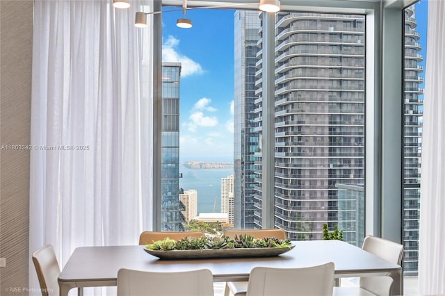 88 SW 7th St Unit 4101, Miami, FL 33130 - dining space featuring a water view