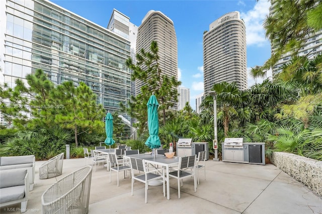 88 SW 7th St Unit 4101, Miami, FL 33130 - view of patio featuring outdoor dining space and area for grilling