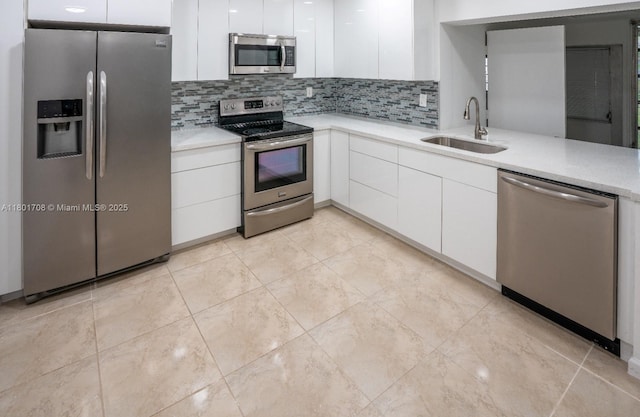 17252 SW 112th Pl Unit 21243, Miami, FL 33157 - kitchen with stainless steel appliances, a sink, white cabinetry, and modern cabinets