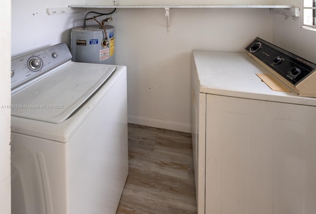 17252 SW 112th Pl Unit 21243, Miami, FL 33157 - clothes washing area with water heater, wood finished floors, baseboards, and washing machine and dryer