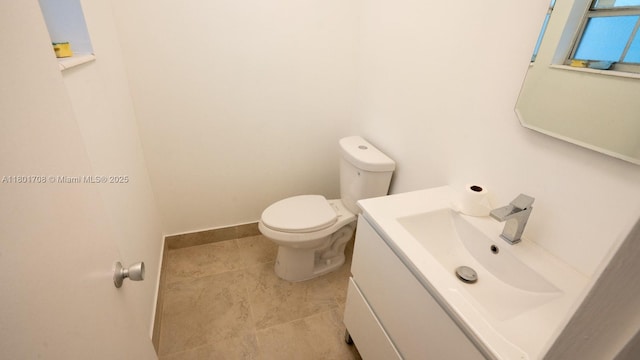 17252 SW 112th Pl Unit 21243, Miami, FL 33157 - half bath featuring toilet, vanity, baseboards, and tile patterned floors