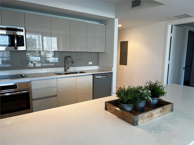 2600 E Hallandale Beach Blvd Unit T401, Hallandale Beach, FL 33009 - kitchen featuring stainless steel appliances, a sink, modern cabinets, and light countertops