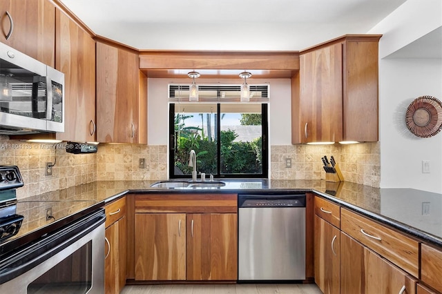 5630 W Waterford Dr, Davie, FL 33331 - kitchen with stainless steel appliances, a sink, and brown cabinets