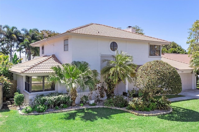 5630 W Waterford Dr, Davie, FL 33331 - view of home's exterior with a chimney, stucco siding, and a yard
