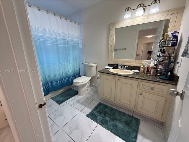 full bathroom featuring toilet, vanity, and a shower with curtain