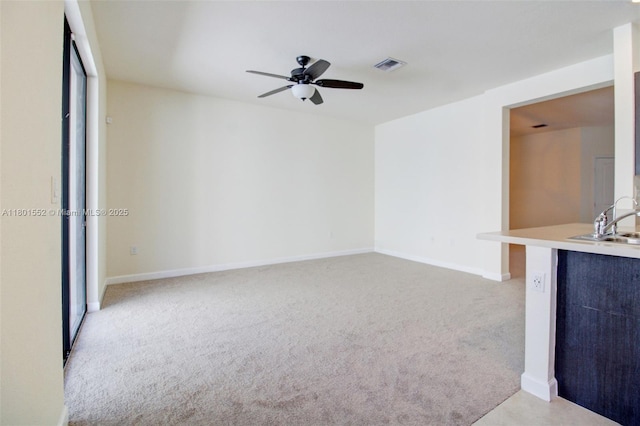 11094 W 33rd Way, Hialeah, FL 33018 - unfurnished living room featuring light colored carpet, a ceiling fan, a sink, and baseboards
