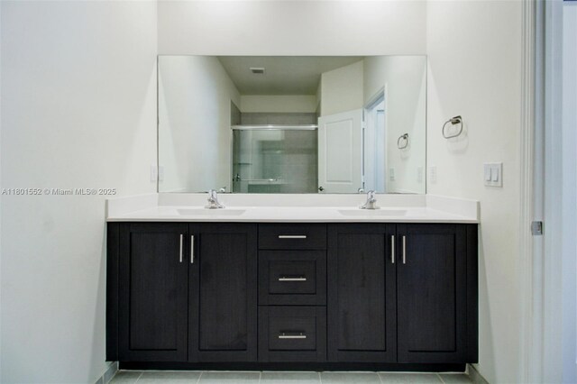 11094 W 33rd Way, Hialeah, FL 33018 - full bathroom featuring a shower stall, double vanity, tile patterned floors, and baseboards