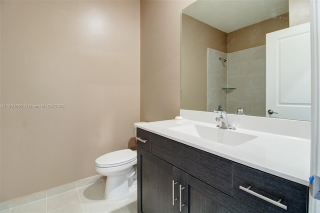 11094 W 33rd Way, Hialeah, FL 33018 - bathroom featuring toilet, tiled shower, vanity, tile patterned floors, and baseboards