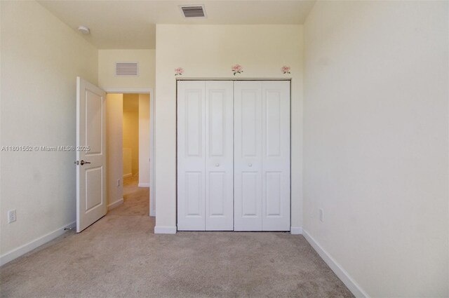 11094 W 33rd Way, Hialeah, FL 33018 - unfurnished bedroom featuring carpet flooring, baseboards, and a closet