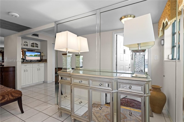 900 Colony Point Cir Unit 523, Pembroke Pines, FL 33026 - kitchen with white cabinetry, light tile patterned flooring, and baseboards