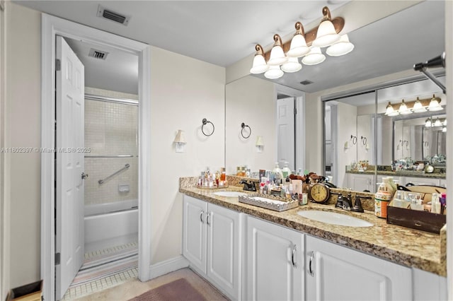 900 Colony Point Cir Unit 523, Pembroke Pines, FL 33026 - bathroom with double vanity, enclosed tub / shower combo, tile patterned flooring, and baseboards
