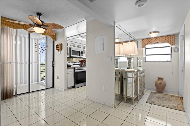 900 Colony Point Cir Unit 523, Pembroke Pines, FL 33026 - kitchen featuring appliances with stainless steel finishes, light tile patterned flooring, and ceiling fan