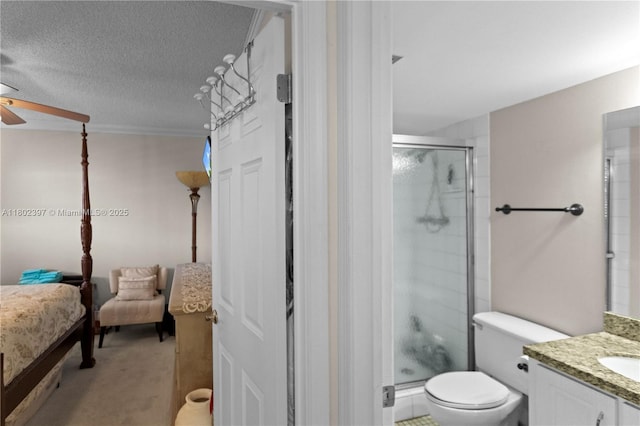 900 Colony Point Cir Unit 523, Pembroke Pines, FL 33026 - ensuite bathroom with ceiling fan, a shower stall, vanity, toilet, and a textured ceiling