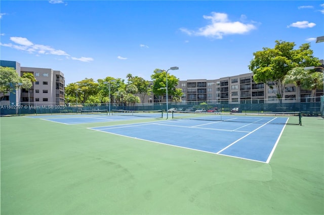 900 Colony Point Cir Unit 523, Pembroke Pines, FL 33026 - view of tennis court with fence and community basketball court