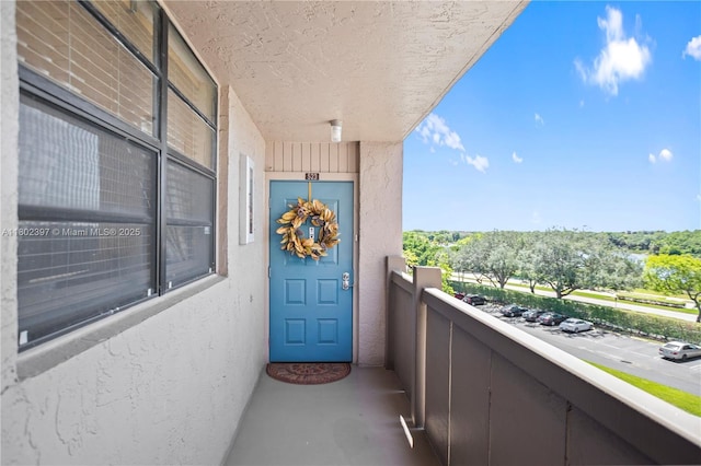 900 Colony Point Cir Unit 523, Pembroke Pines, FL 33026 - doorway to property featuring stucco siding and a balcony