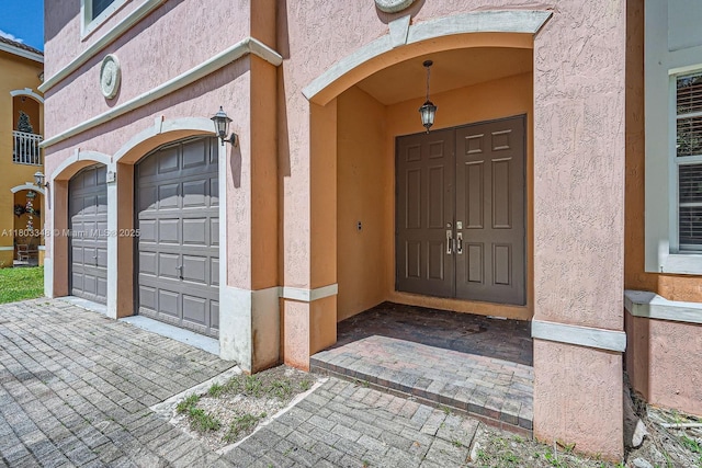 17668 SW 135th Ct, Miami, FL 33177 - entrance to property with stucco siding and a garage