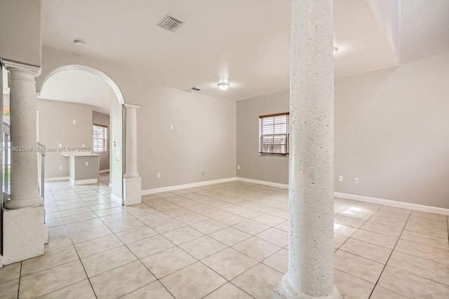 17668 SW 135th Ct, Miami, FL 33177 - empty room with ornate columns, light tile patterned floors, and healthy amount of natural light