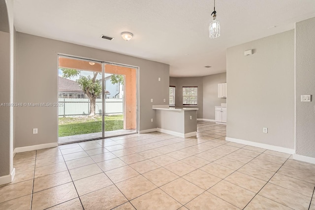 17668 SW 135th Ct, Miami, FL 33177 - unfurnished living room with light tile patterned flooring and baseboards