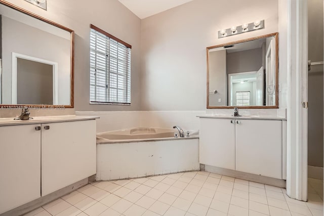 17668 SW 135th Ct, Miami, FL 33177 - full bathroom featuring a bath, two vanities, and tile patterned floors