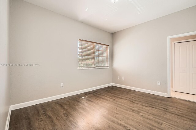 17668 SW 135th Ct, Miami, FL 33177 - empty room with baseboards and wood finished floors