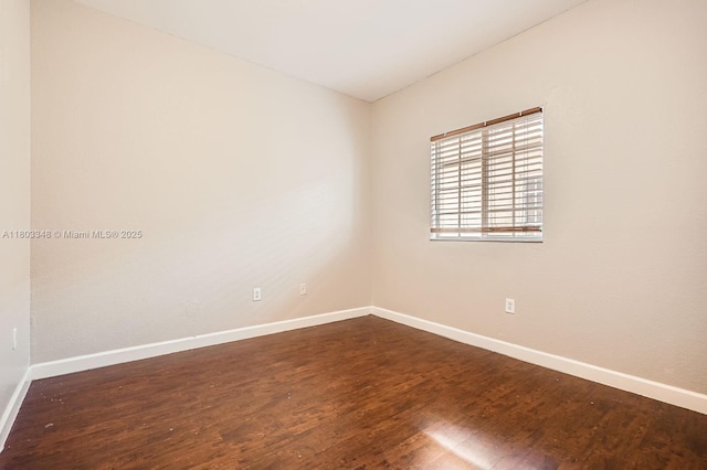 17668 SW 135th Ct, Miami, FL 33177 - empty room featuring baseboards and dark wood-style floors