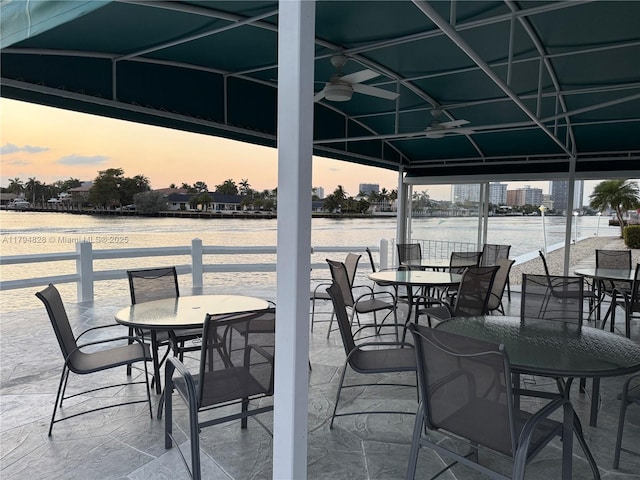 3209 S Ocean Dr Unit 2M, Hallandale Beach, FL 33009 - view of patio / terrace featuring a ceiling fan, a water view, a gazebo, and outdoor dining area