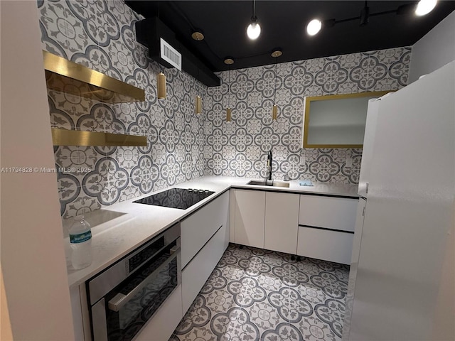 3209 S Ocean Dr Unit 2M, Hallandale Beach, FL 33009 - kitchen featuring a sink, white cabinetry, black electric stovetop, open shelves, and stainless steel oven
