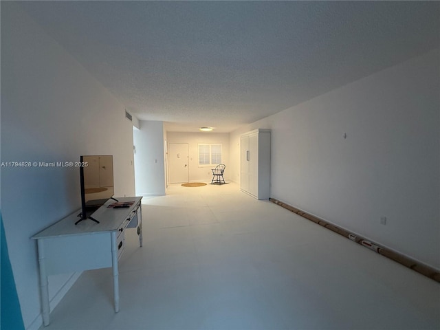 3209 S Ocean Dr Unit 2M, Hallandale Beach, FL 33009 - hallway with a textured ceiling