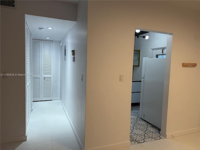 3209 S Ocean Dr Unit 2M, Hallandale Beach, FL 33009 - corridor with baseboards, recessed lighting, and light floors