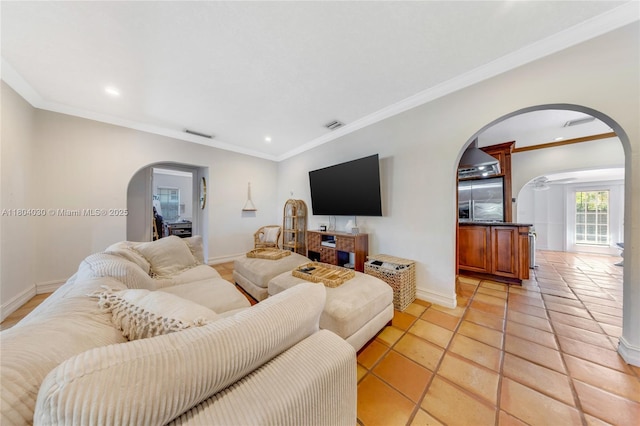 3610 SW 59th Ave, Miami, FL 33155 - living room with arched walkways, recessed lighting, ornamental molding, baseboards, and light tile patterned floors