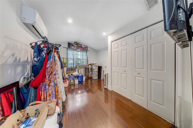 3610 SW 59th Ave, Miami, FL 33155 - walk in closet featuring a wall mounted air conditioner, vaulted ceiling, and wood finished floors