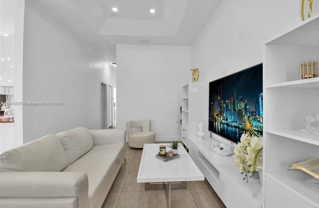 12202 SW 216th St, Miami, FL 33170 - tiled living room featuring a raised ceiling and recessed lighting