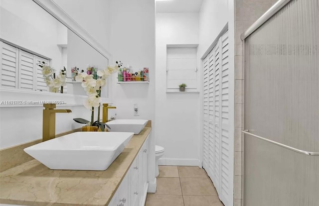 12202 SW 216th St, Miami, FL 33170 - bathroom featuring toilet, tile patterned flooring, double vanity, and an enclosed shower