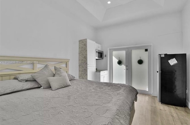 12202 SW 216th St, Miami, FL 33170 - bedroom with light wood-style flooring, freestanding refrigerator, and recessed lighting