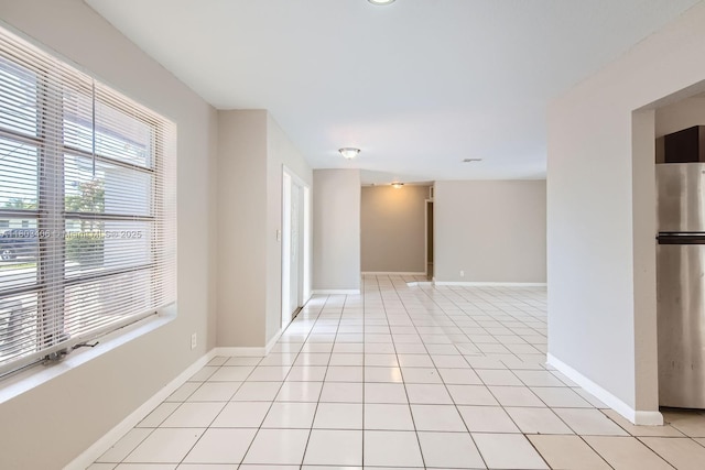 3226 NW 41st St, Lauderdale Lakes, FL 33309 - spare room with baseboards and light tile patterned flooring