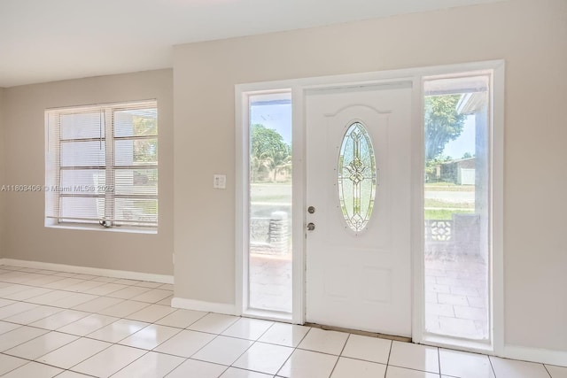 3226 NW 41st St, Lauderdale Lakes, FL 33309 - entrance foyer with baseboards and light tile patterned flooring