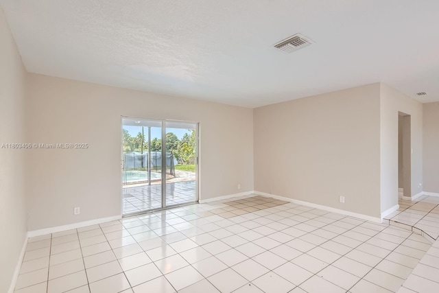 3226 NW 41st St, Lauderdale Lakes, FL 33309 - empty room with baseboards and light tile patterned floors