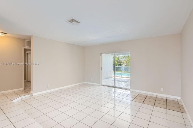 3226 NW 41st St, Lauderdale Lakes, FL 33309 - spare room featuring baseboards and light tile patterned floors