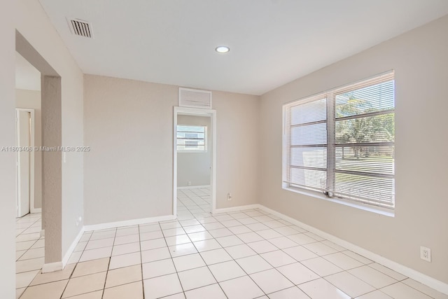 3226 NW 41st St, Lauderdale Lakes, FL 33309 - spare room featuring healthy amount of natural light, baseboards, recessed lighting, and light tile patterned flooring