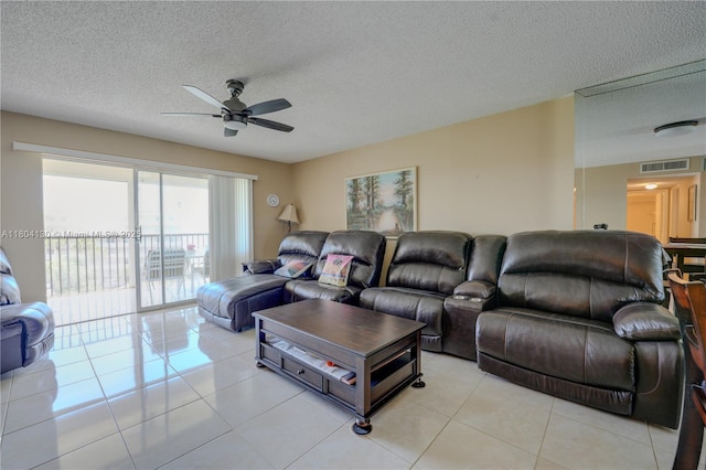 170 SE 5th Ave Unit 505, Dania Beach, FL 33004 - living room with ceiling fan, light tile patterned flooring, and a textured ceiling